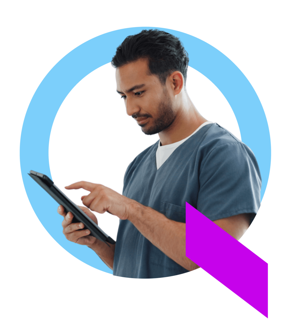 A healthcare professional in scrubs using his tablet to create a patient discharge plan using the Qventus inpatient solution